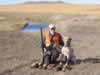 Hacker and Dianne enjoying a successful day pheasant hunting in southwestern North Dakota October 2002 (Photograph by Kurt Gruber)